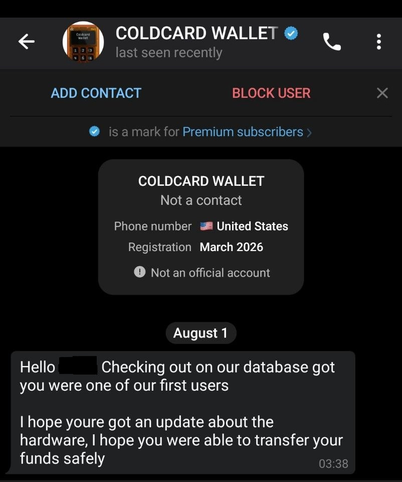 Telegram conversation screenshot. The header shows a contact named COLDCARD WALLET with a blue check mark, above buttons reading ADD CONTACT and BLOCK USER, and a line explaining that the blue mark is a mark for Premium subscribers. A contact card below reads COLDCARD WALLET, Not a contact, Phone number United States, Registration March 2026, and a warning reading Not an official account. Under a date divider reading August 1, one message at 03:38 reads: Hello, followed by a blacked-out name, Checking out on our database got you were one of our first users. I hope youre got an update about the hardware, I hope you were able to transfer your funds safely.